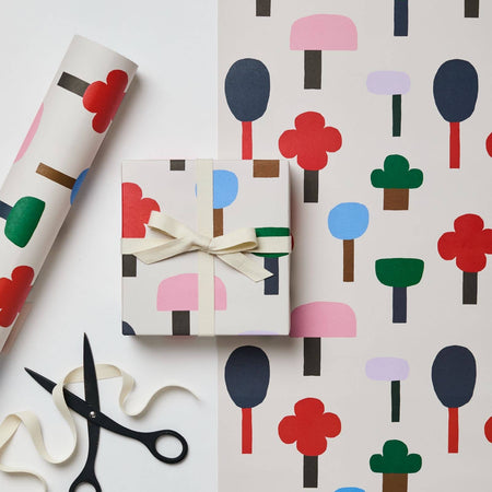 Gift box with colorful tree pattern and scissors on a white background. Wrapping paper | Kinshipped | Shop Fodder