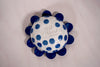 the base of a flower dish with the makers mark of ceramicist beci callow. 