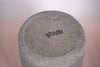 Brutes Ceramics makers mark in a dark glaze stamp on the bottom of a textured grey clay form. 