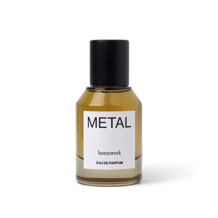 Perfume bottle labeled 'Metal' by 'homework' on a white background | Homework Store | Shop Fodder