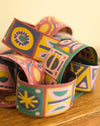 Colorful patterned bracelets on a wooden surface